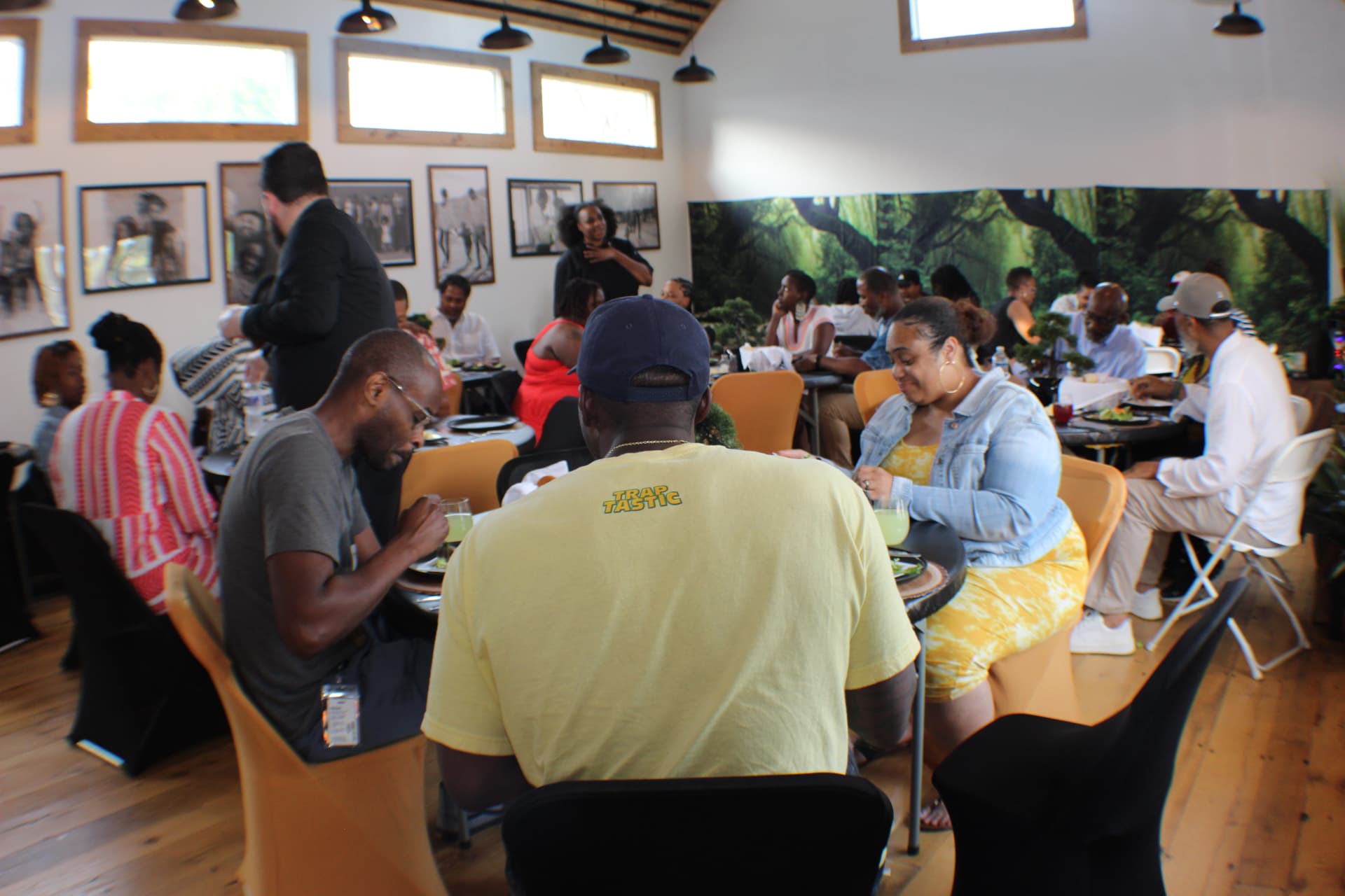 Community-rooted™ leaders talking together around small round tables