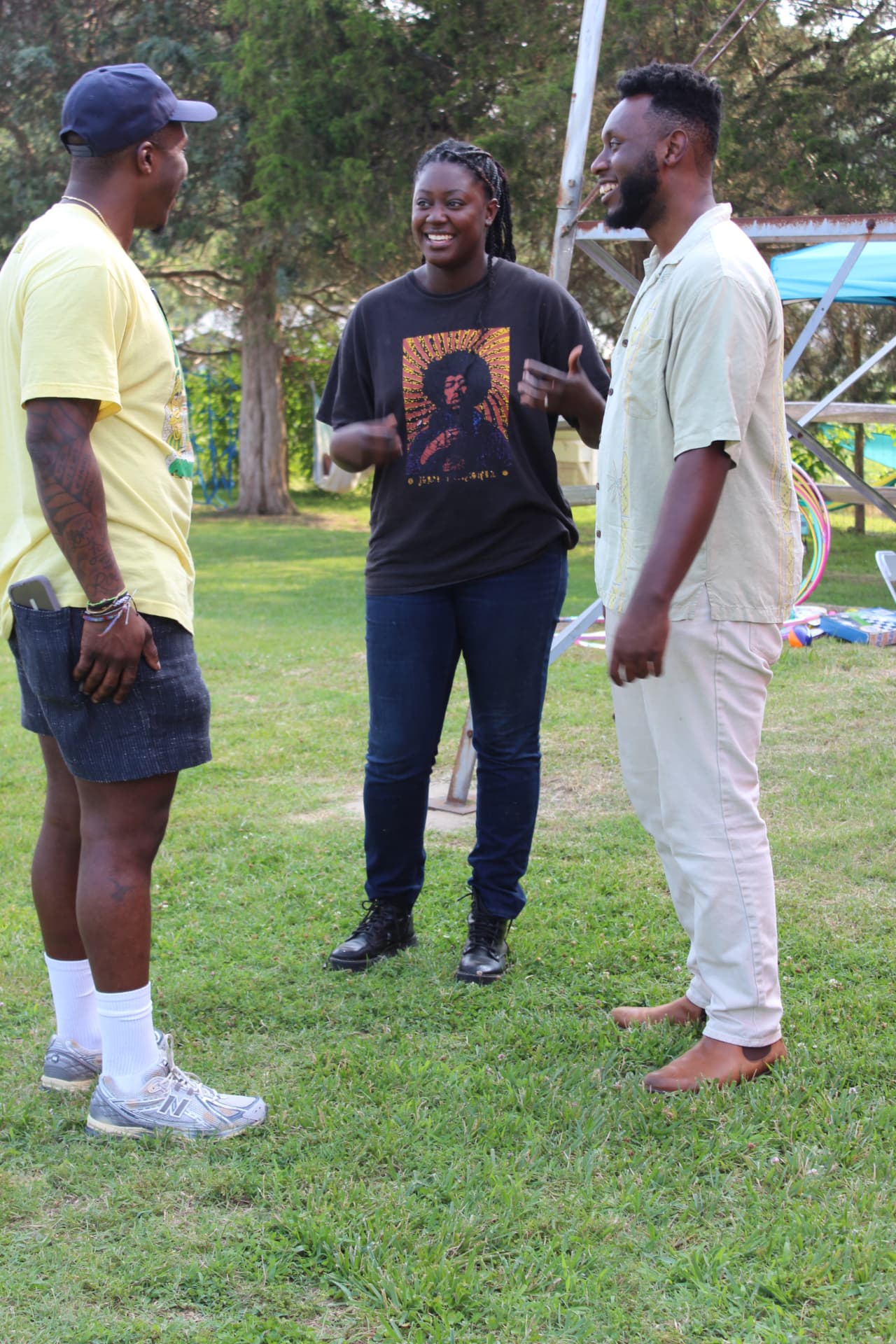 Neighbors in conversation together on a lawn